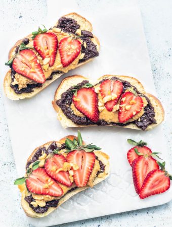 peanut butter chocolate spread on toast with strawberries