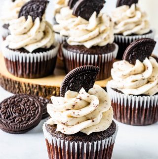 Oreo Cupcakes arranged on top of a wood board