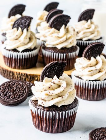 Oreo Cupcakes arranged on top of a wood board