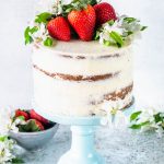 Pineapple and Strawberry layer cake topped with fresh flowers