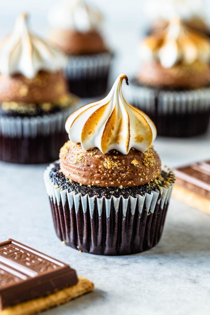 S'mores cupcakes topped with toasted marshmallow and filled with milk chocolate ganache