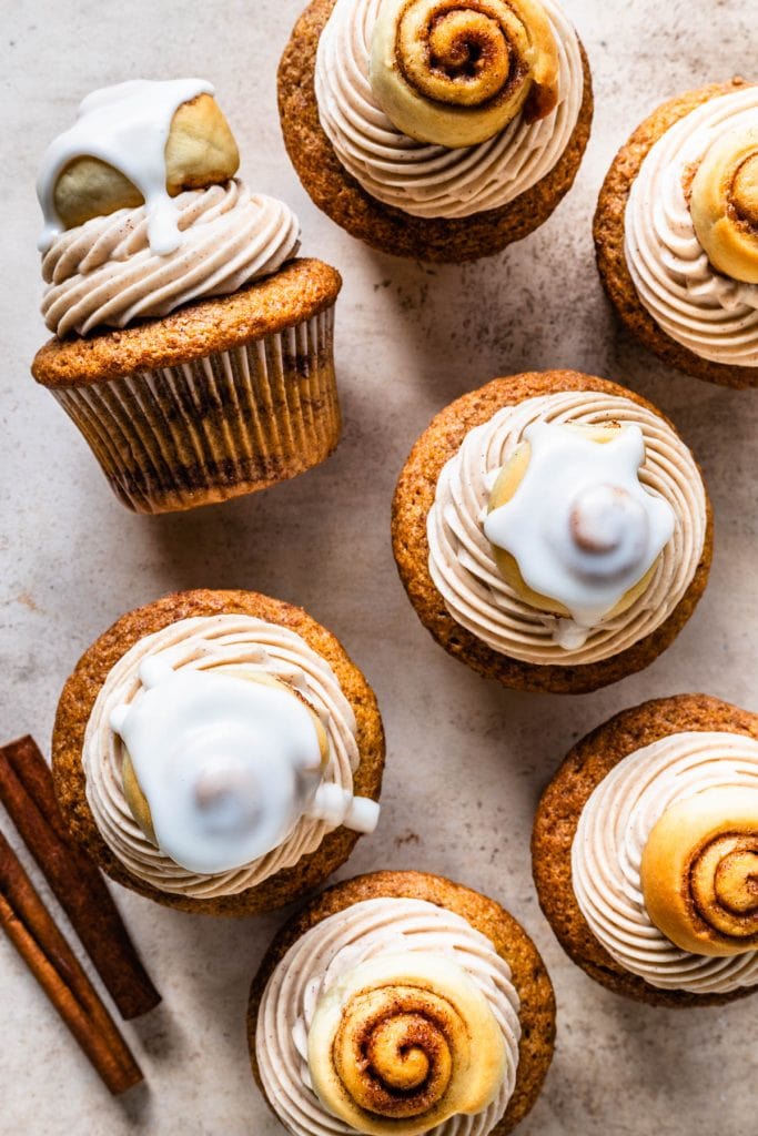 Cinnamon Roll Cupcakes topped with a glazed mini cinnamon roll seen from the top.
