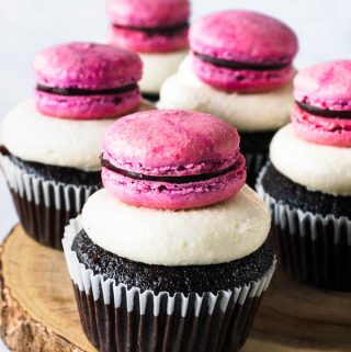 Raspberry Almond Chocolate Cupcakes topped with raspberry macaron