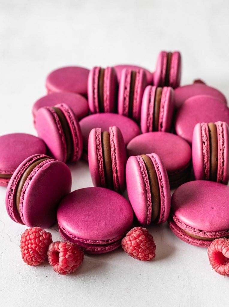raspberry macarons with pink macaron shells, filled with chocolate ganache and raspberry jam.