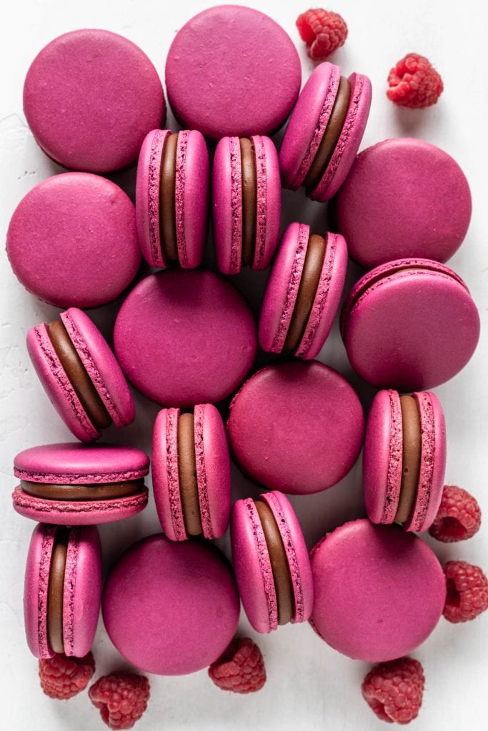 raspberry macarons with pink macaron shells, filled with chocolate ganache and raspberry jam.