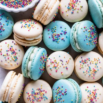 Funfetti Macarons topped with sprinkles.