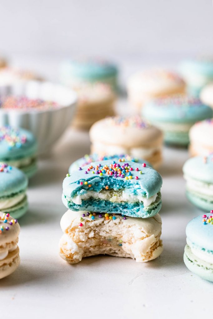 Funfetti Macarons topped with sprinkles.
