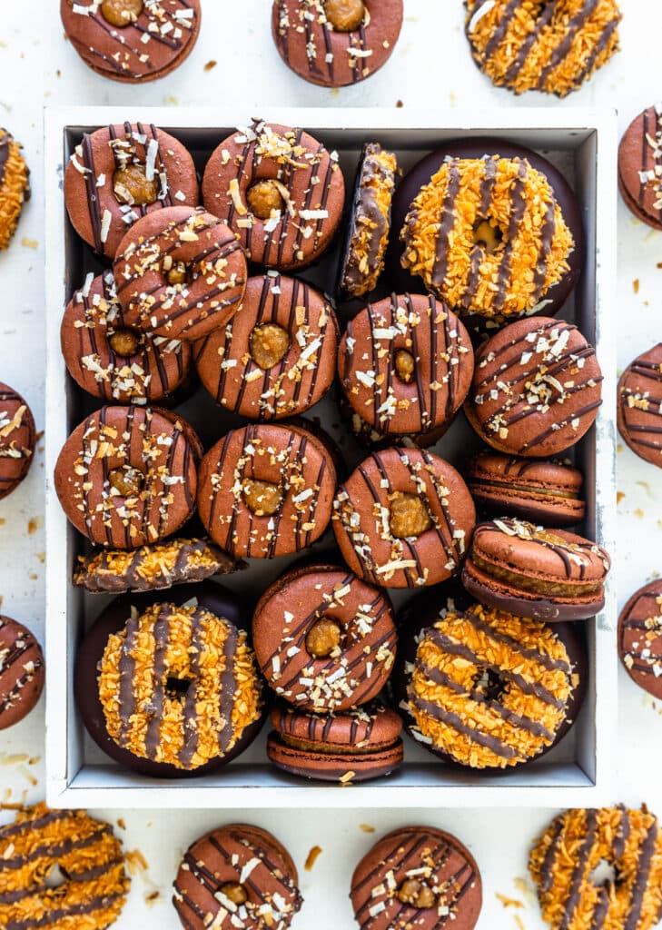 samoa macarons shaped like donuts filled with toasted coconut caramel.
