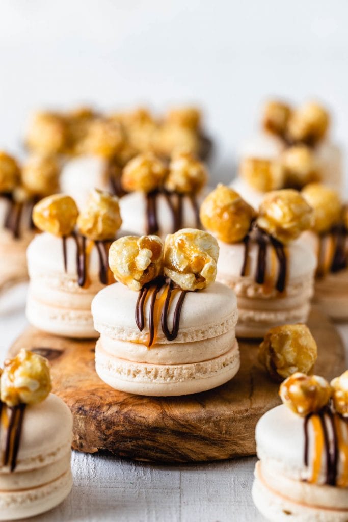 Popcorn Macarons filled with caramel buttercream and topped with caramel popcorn.