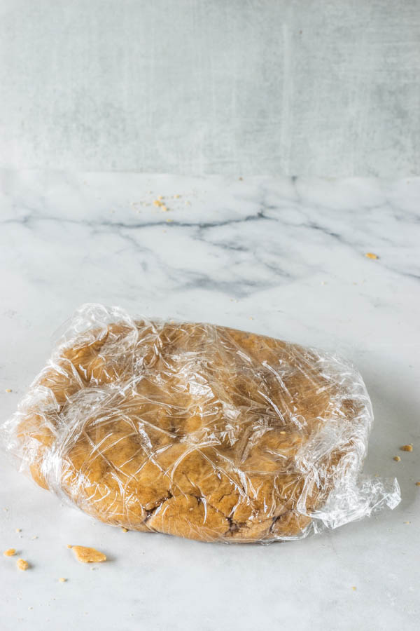 vegan graham cracker dough wrapped in plastic wrap