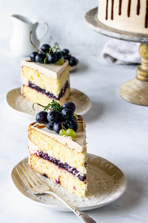 cake filled with grape jam with balsamic caramel swiss meringue buttercream