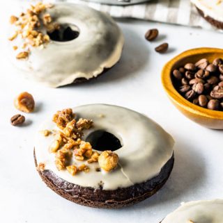vegan coffee donuts with coffee glaze and caramelized nuts