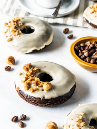 vegan coffee donuts with coffee glaze and caramelized nuts