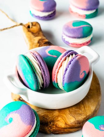 multi-color macarons in a small plate
