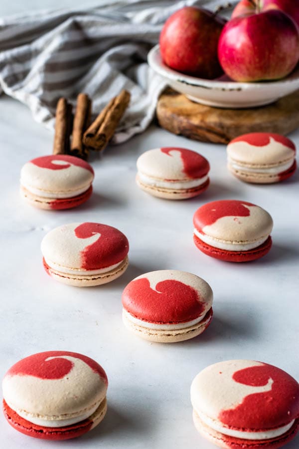 apple macarons with cinnamon cream cheese frosting and apple filling