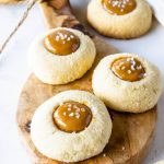 Dulce de Leche thumbprint cookies filled with dulce de leche caramel and sprinkled with sea salt