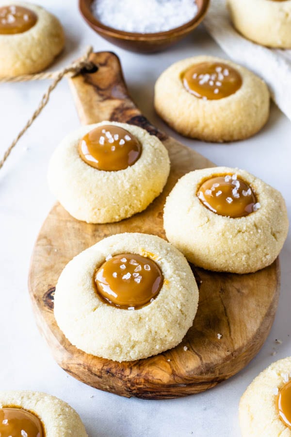 Dulce de Leche thumbprint cookies filled with dulce de leche caramel and sprinkled with sea salt