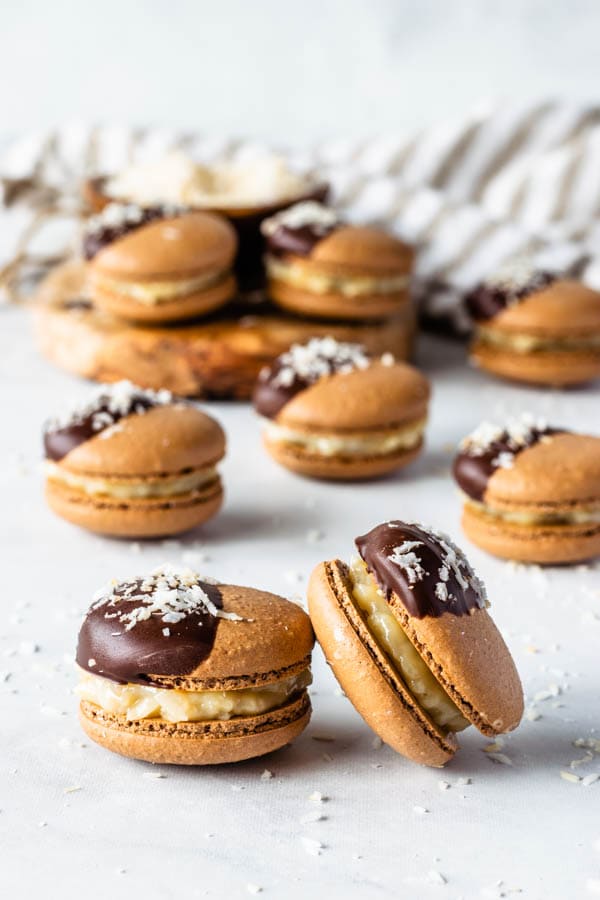 german chocolate macarons chocolate macarons filed with coconut fudge and topped with chocolate and coconut flakes