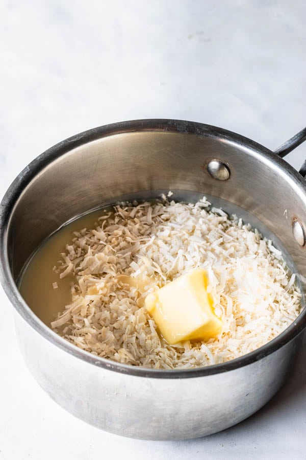 condensed milk, coconut flakes, and butter in a small sauce pan to make coconut fudge