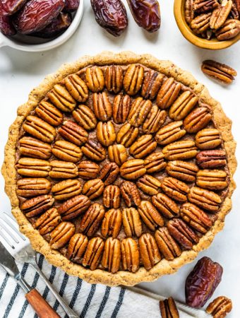 Vegan Pecan Pie also paleo, refined sugar free, covered with pecans, made with dates