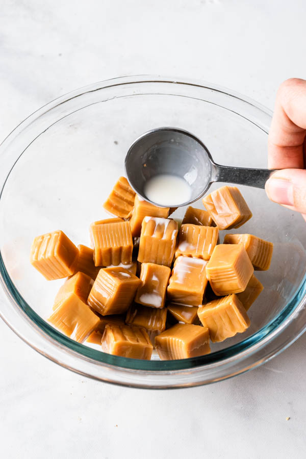 caramel candies with heavy cream in a bowl