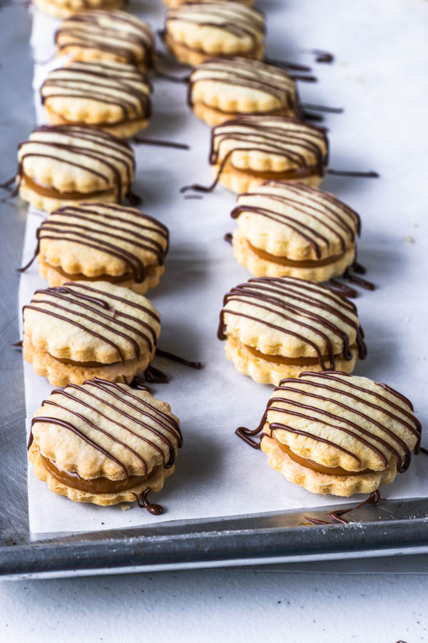 alfajor cookies drizzled with chocolate on top