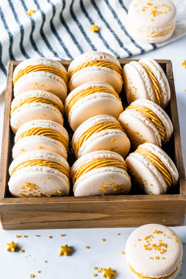 Butterbeer Macarons with Butterbeer buttercream and butterscotch ganache filling topped with gold sugar
