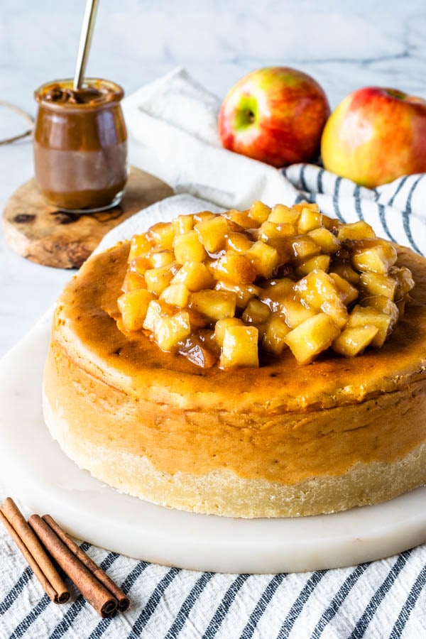 dulce de leche apple cheesecake topped with apples