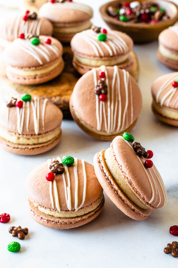 Gingerbread Macarons filled with gingerbread buttercream topped with christmas sprinkles