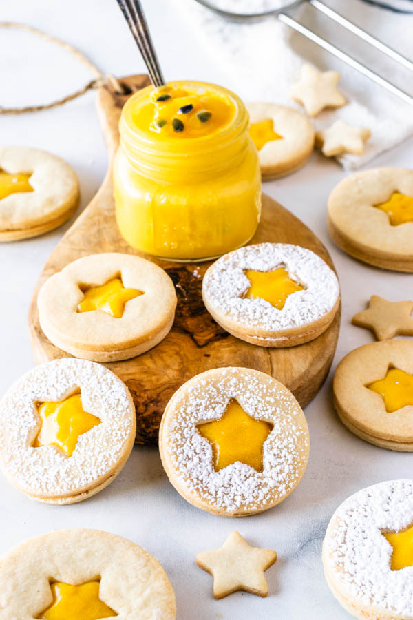 Passion Fruit Cookies filled with passion fruit curd, dusted with powdered sugar