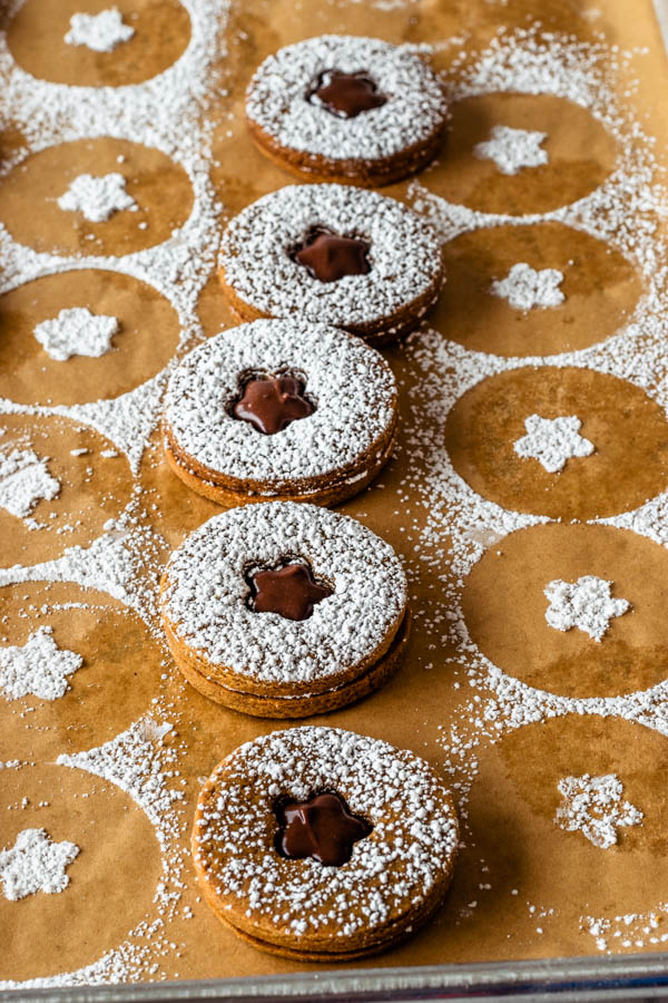 Vegan Gingerbread Cookies with Fudge Filling dusted with powdered sugar