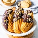 Vegan Peanut Butter Madeleines dipped in chocolate and topped with peanuts