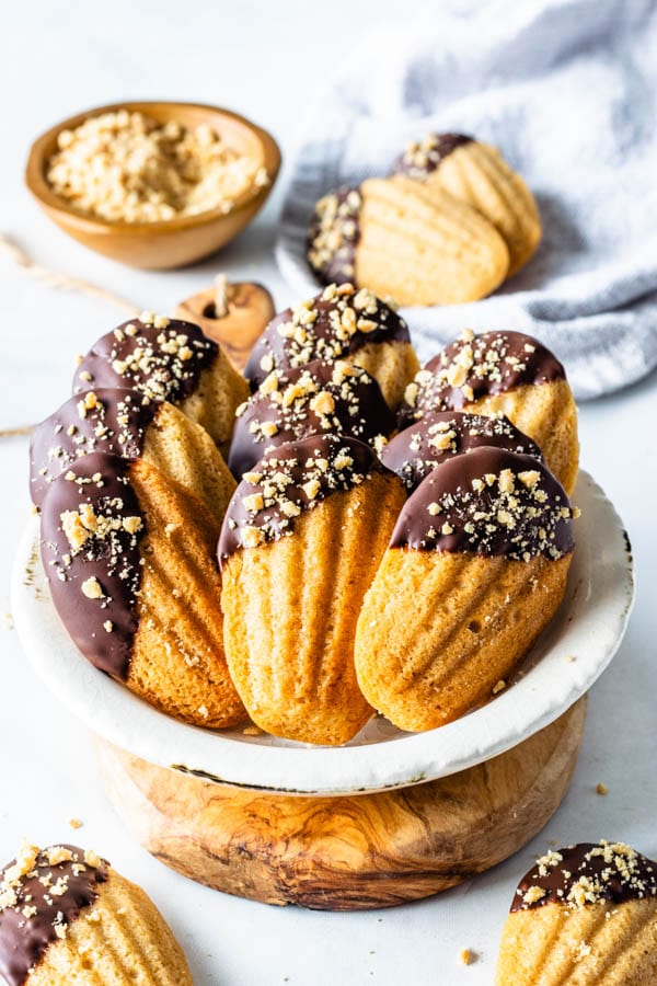 Vegan Peanut Butter Madeleines dipped in chocolate and topped with peanuts