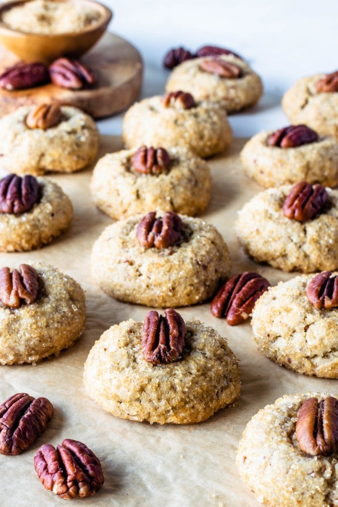 Vegan Pecan Cookies with a touch of bourbon topped with a pecan