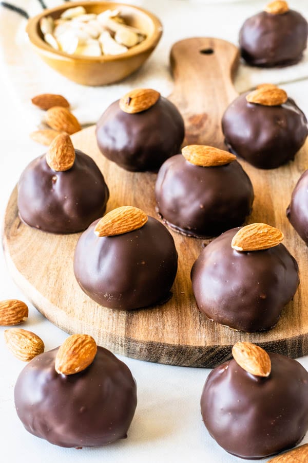 Vegan Almond Tahini Truffles covered in chocolate topped with almond