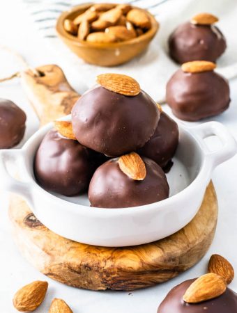 Vegan Almond Tahini Truffles covered in chocolate topped with almond