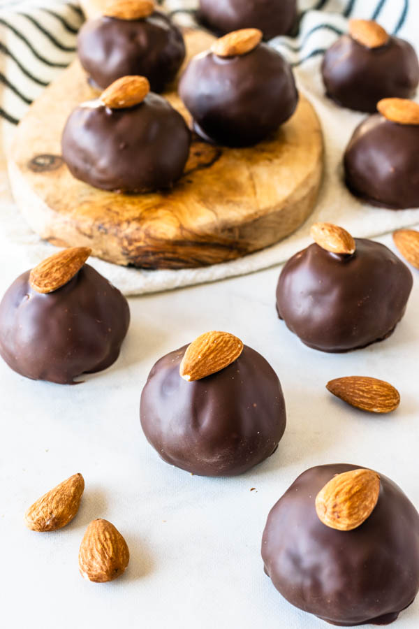Almond Tahini Truffles covered in chocolate topped with almond