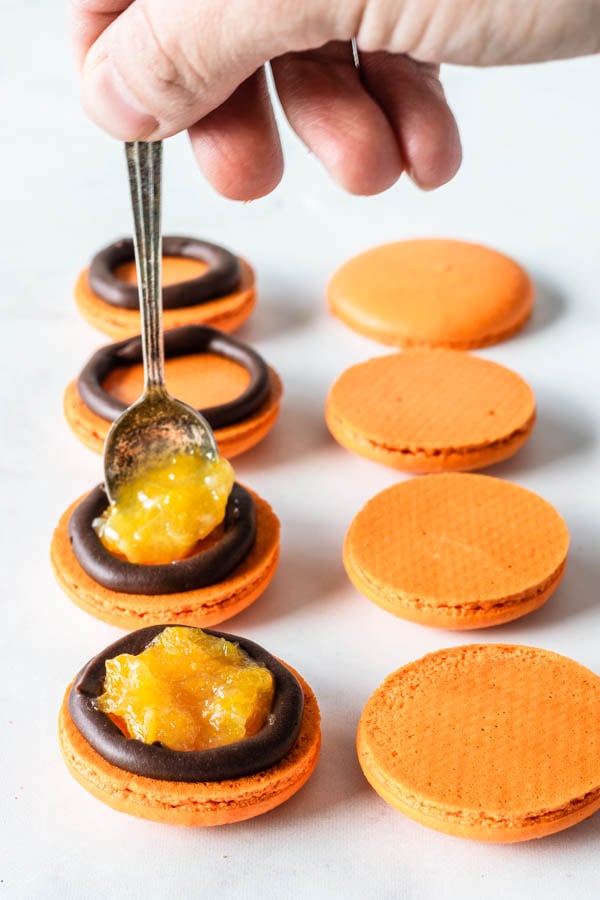 filling macarons with orange marmalade