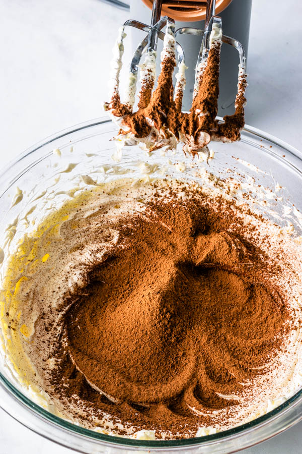 cocoa powder added to creamed butter to make sweet condensed milk frosting