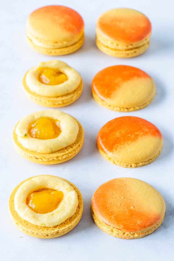 Mango Macarons ring of mango buttercream and mango jam in the middle
