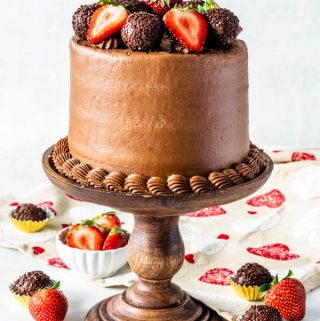 Strawberry Nutella Cake with strawberries and truffles on top