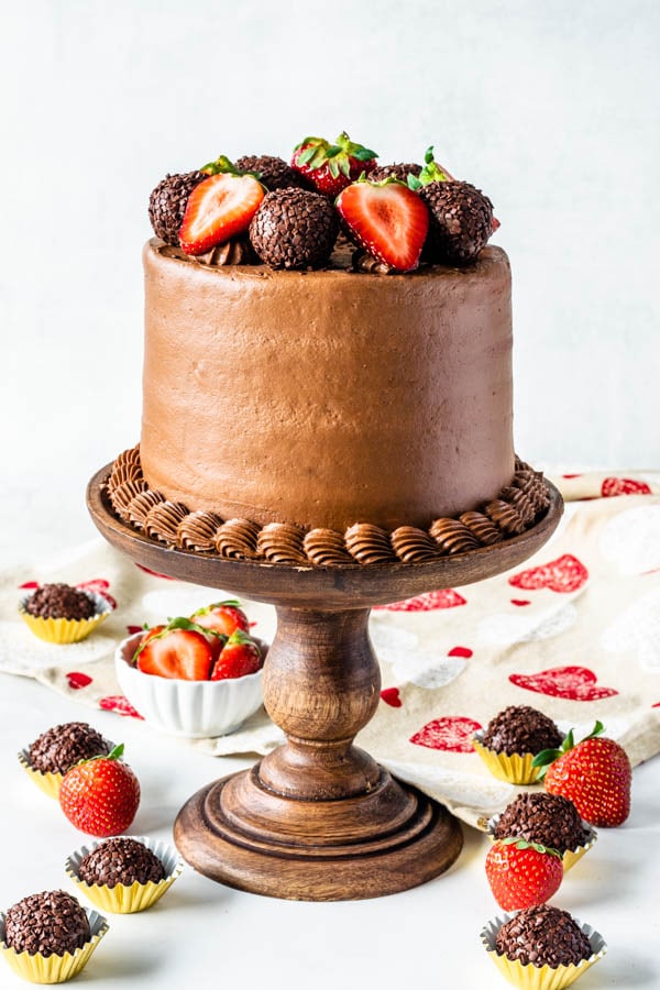 Strawberry Nutella Cake with strawberries and truffles on top