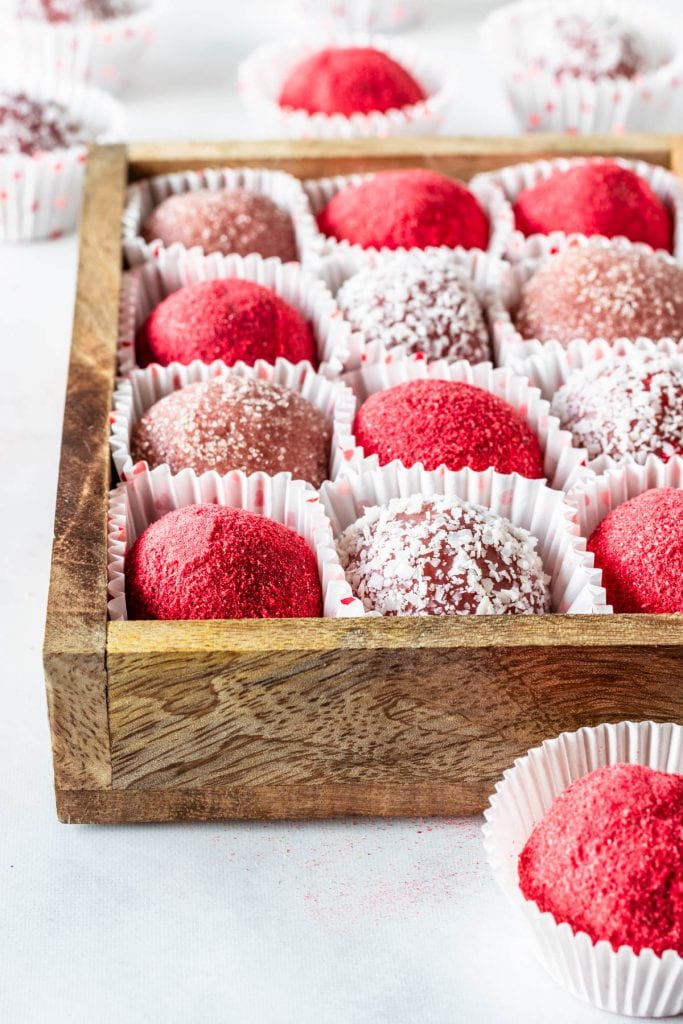 White Chocolate Strawberry truffles coated in coconut, freeze dried strawberry powder, and sugar