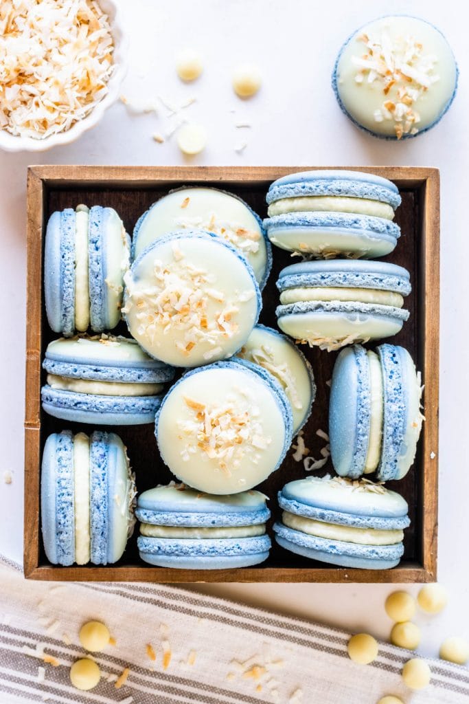 Coconut Macarons topped with white chocolate and toasted coconut