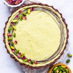 No Bake Pistachio Pie topped with pistachios drizzled chocolate and dried rose petals
