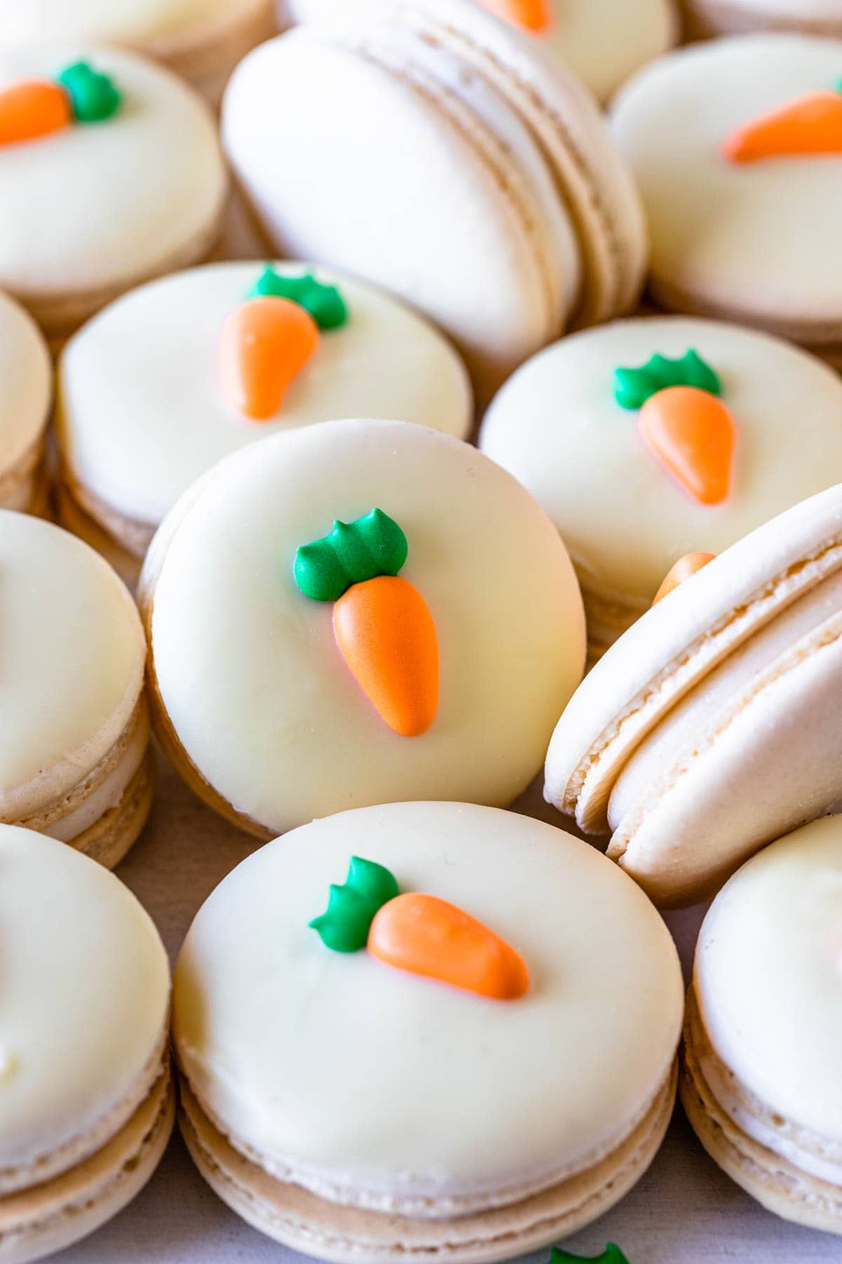 Carrot Cake Macarons topped with a royal icing carrot