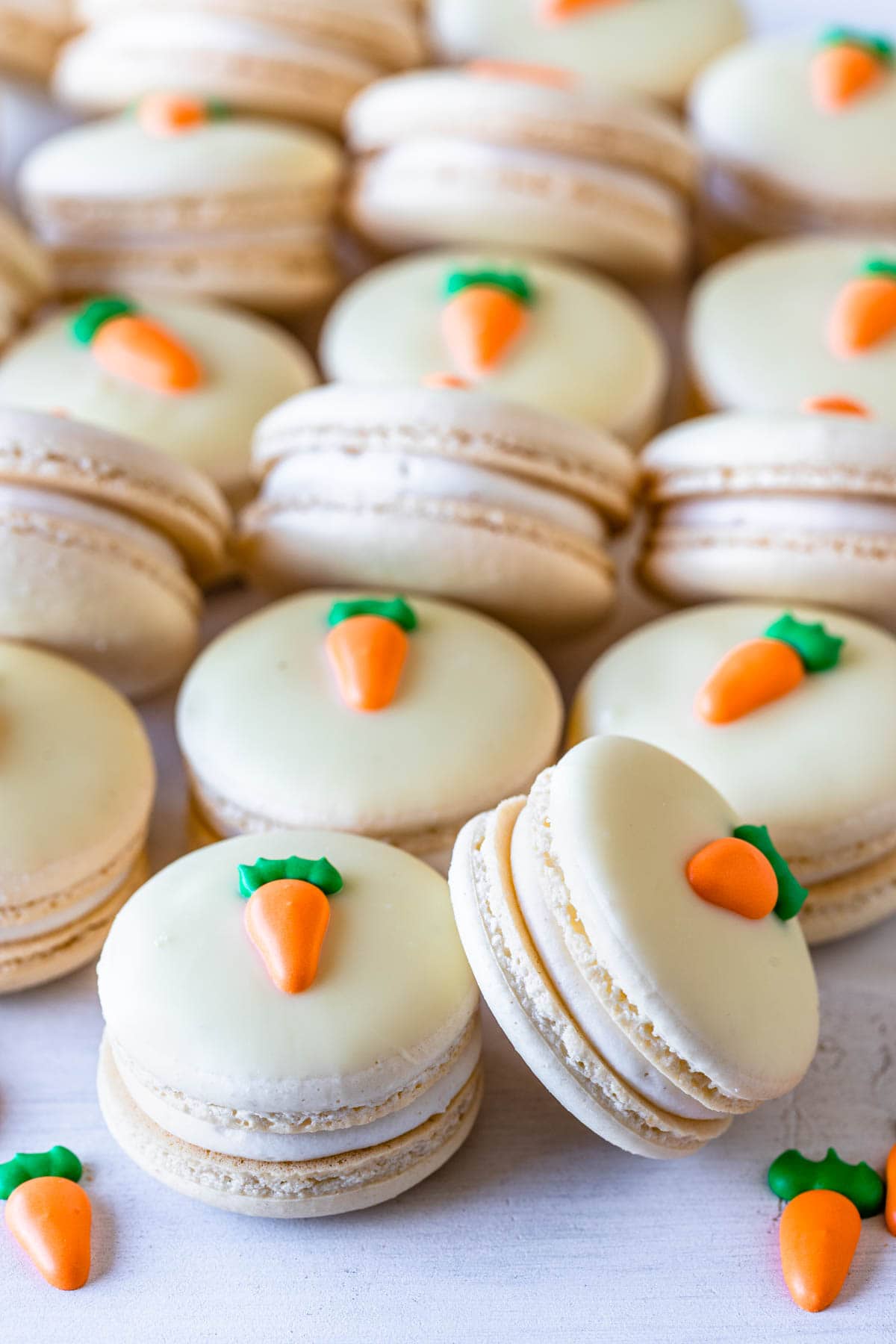 Carrot Cake Macarons topped with a royal icing carrot