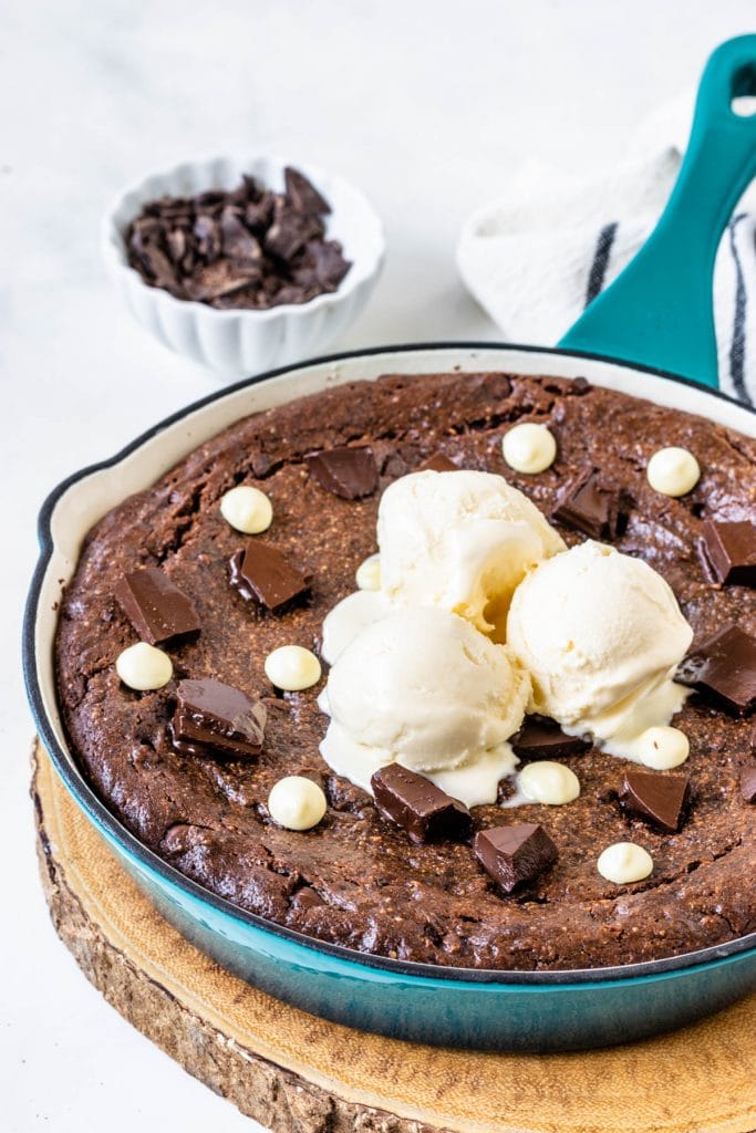 vegan brownie topped with ice cream