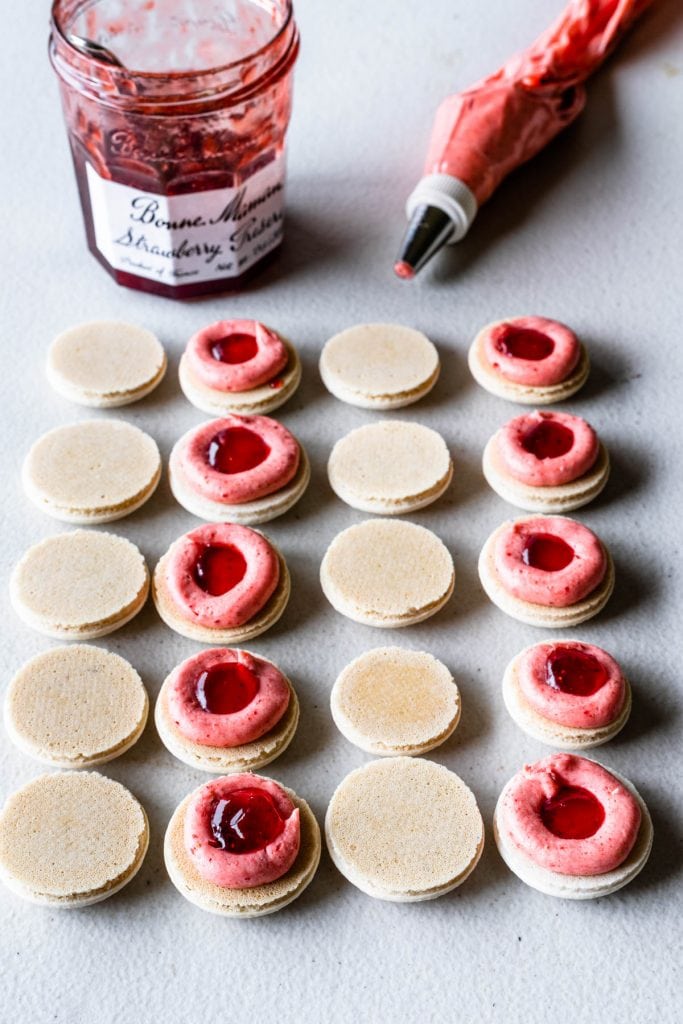 Vegan macarons with strawberry buttercream and jam filling