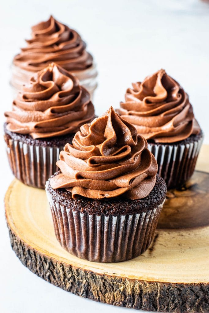 chocolate cupcakes piped with nutella frosting on top